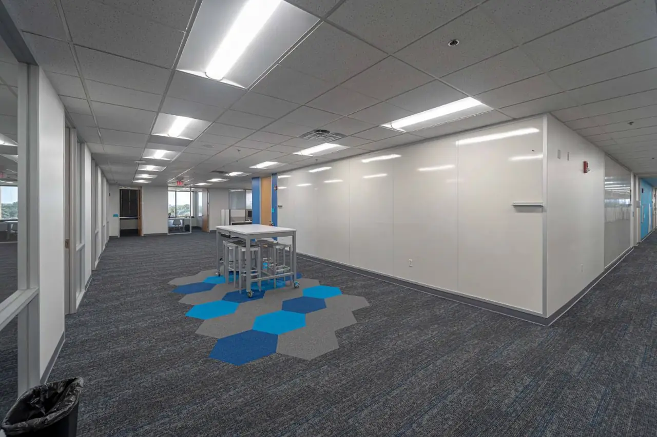 Office collaboration space with modern lighting