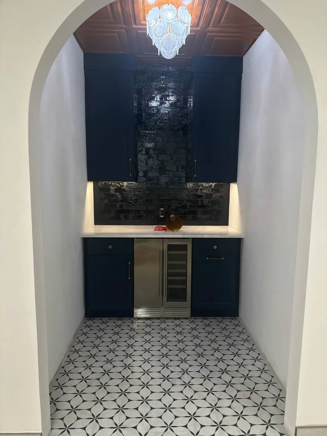Custom residential wet bar with accent lighting